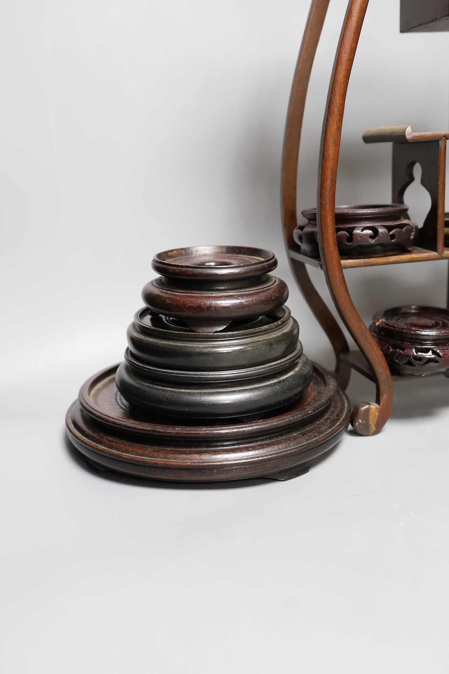 A Chinese wood shelf and various wood stands, tallest 45cm